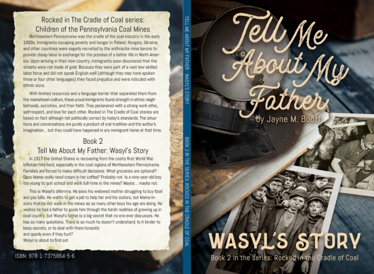 The cover of the book, Tell Me About My Father. Featured are black and white photos on a table along with a cap and a mining lamp